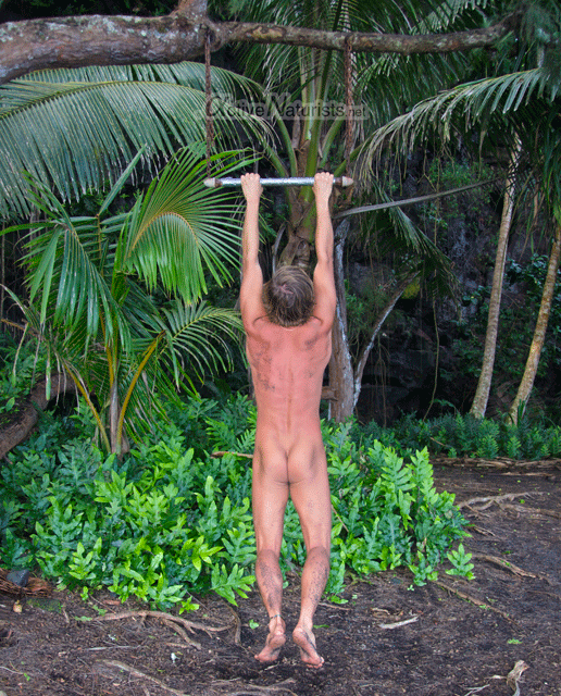 naturist-pull-ups-Kehena-black-sand-beach,-Hawaii,-USA